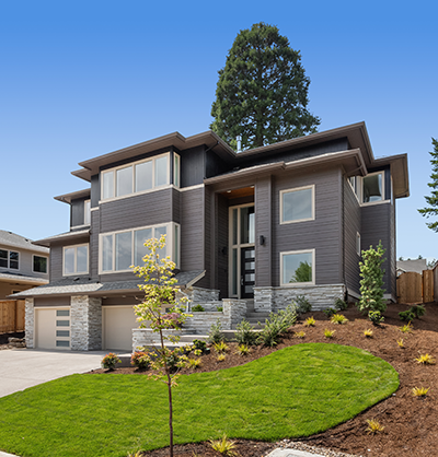 modern home with landcaped yard